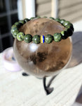 Serpentine gemstone bracelet with state colored Heishi beads.